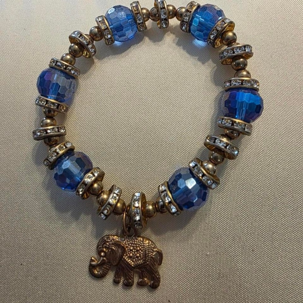 Blue‎ and gold beaded bracelet with elephant charm